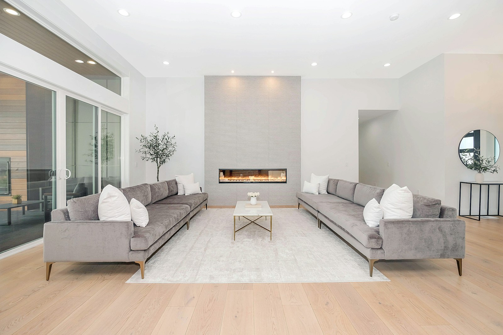 Photo by Zac Gudakov white couch and brown wooden table